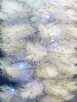 Background of an artificial white fur-tree with fires