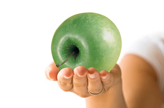 Combination with hand and a green apple