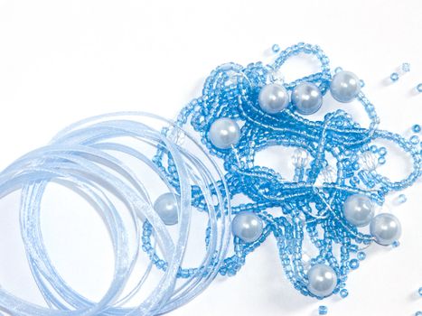 The image of the torn beads and a kapron tape on a white background