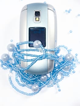 The image of the torn beads and a mobile phone on a white background