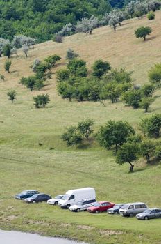 touristic camp: vehicles parked at the meadow