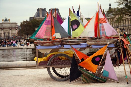 Many small colorful ships ready to navigate in a parisian park