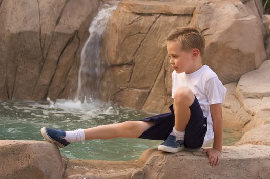 Young Boy Portrait Near Swimming Pool