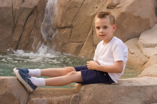 Young Boy Portrait Near Swimming Pool