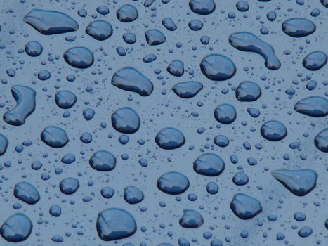 large raindrops on blue background