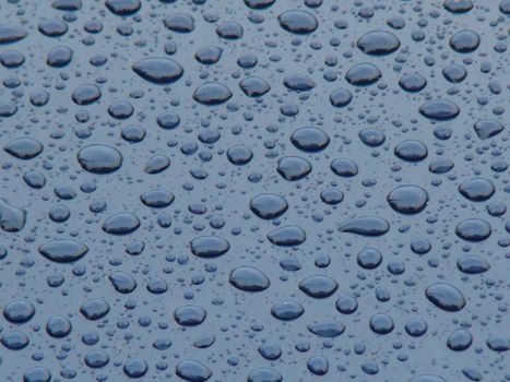 small raindrops on blue background