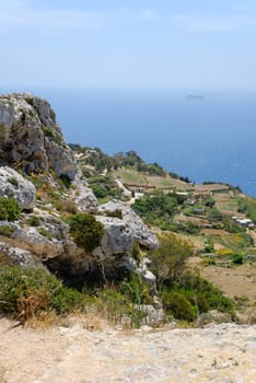 Dingli cliffs at the southern end of Malta, with a view towards Maltese Southernmost territory - Filfla island.
