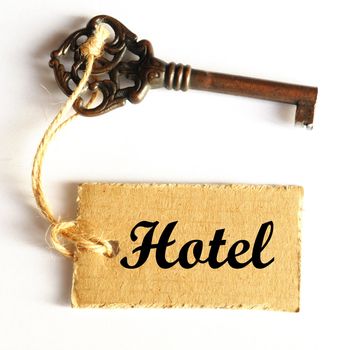 travel concept with hotel key and tag or label