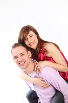 Young, smiling couple. He wears them on his back