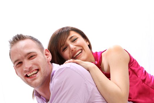 Young, smiling couple. He wears them on his back