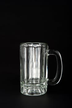 Image of an empty glass mug on black background