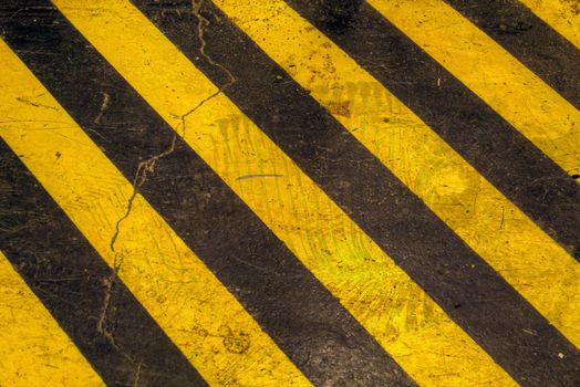Grunge Warning Sign Stripes on Warehouse Floor