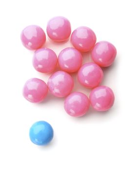 pink and blue bubble gum balls isolated on white - concept for females versus males and sex discrimination