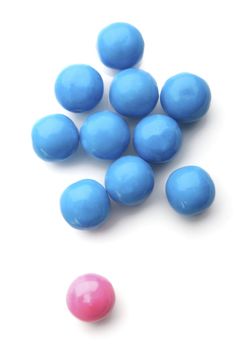 pink and blue bubble gum balls isolated on white - concept for females versus males and sex discrimination