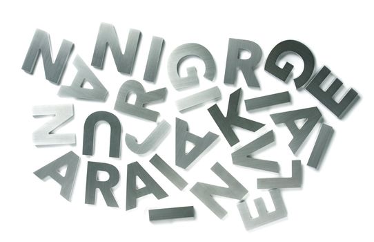 Stylish letters cut out of polished steel isolated on white