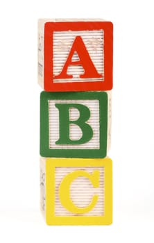 Alphabet blocks lined up to spell abc - isolated on white