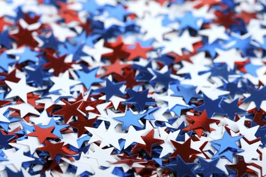 Star shaped confetti - perfect as a election or 4th of july background - focus on stars in front