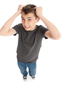 A frustrated and stressed boy or student pulling hair out and grimacing.