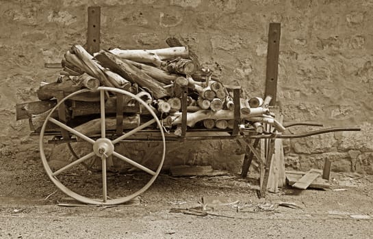 old vintage cart loaded up with wood