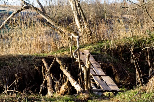 Non-urban landscape with wooden bridge
