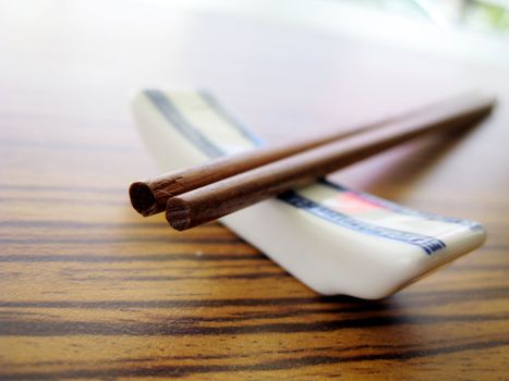 close up for a pair of wooden chopstick, Chinese culture tools for eating