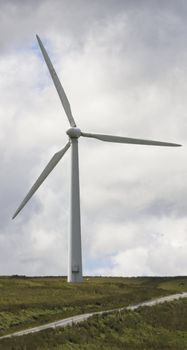 Wind Farm Power Turbines Carno Wales UK against a dark clouds.