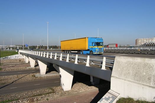 Truck crossing a highway overpass