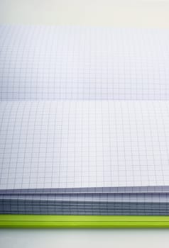 Open schoolbook with crossover lines