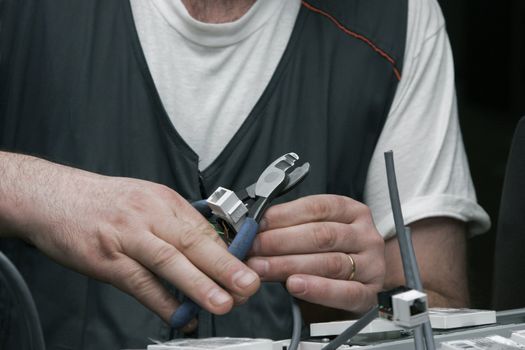 Electrician at work setting up a computer network