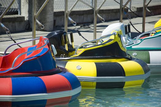 A boat ride where riders squirt water on each other in a pool.