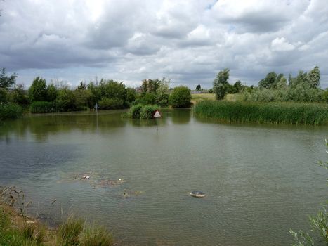 A no fishing sign in the middle of a lake.