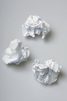 Crumpled paper wads on the floor - concept for creative block