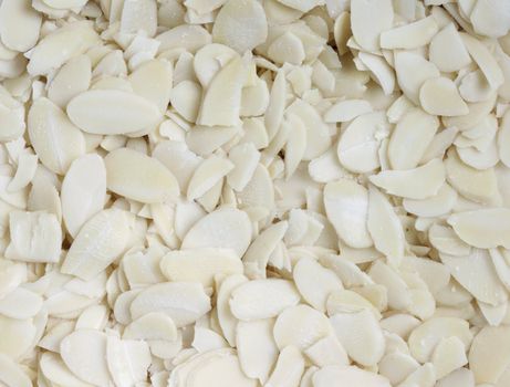 Food background with peeled almonds