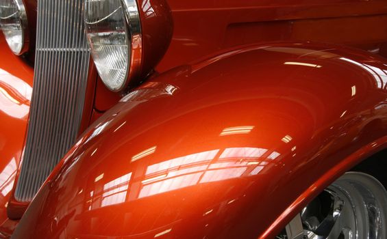 Close-up of a shiny orange hot rod