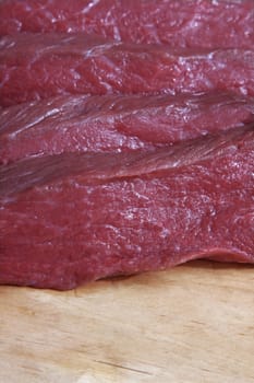 Freshly cut red raw meat close-up