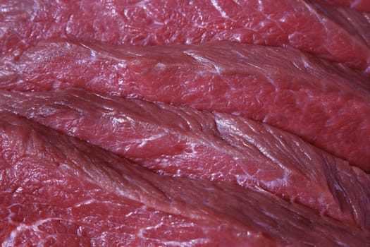 Freshly cut red raw meat close-up