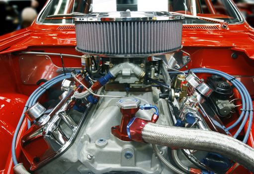 Highly customized car engine in a rebuilt muscle car - all copyright materials removed