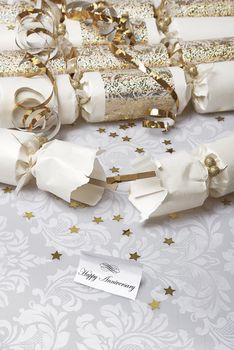 Festive party crackers with a Happy Anniversary note