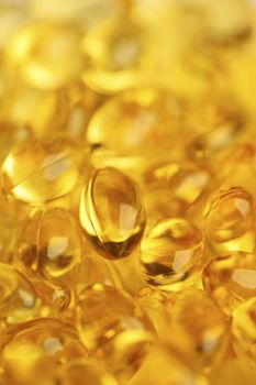 Healthy fish oil nutritional supplements pills / macro with shallow depth of field