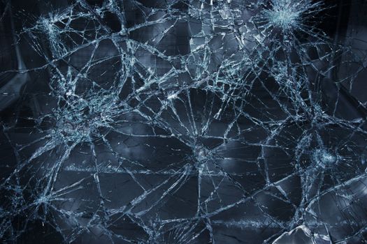 Shattered window surface with cracks all over
