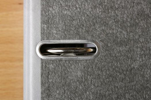 Close-up of a ring binder full of organized files