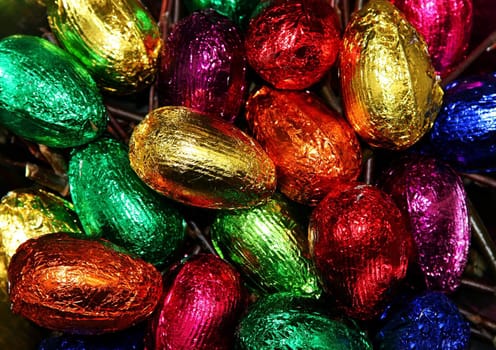 Colorful easter eggs made out of chocolate and wrapped in aluminium