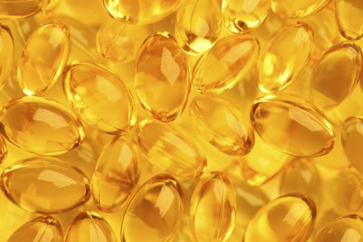 Healthy fish oil nutritional supplements pills / close-up macro