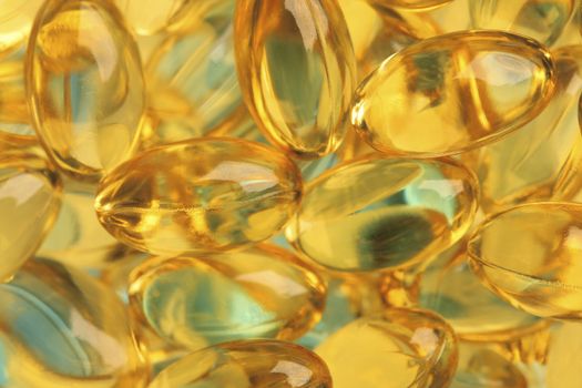 Healthy fish oil nutritional supplements pills / close-up macro