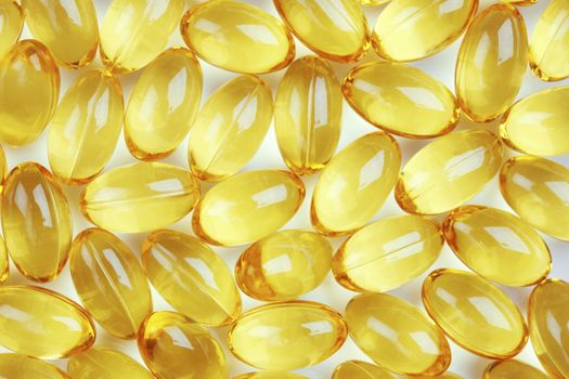 Healthy fish oil nutritional supplements pills / close-up macro
