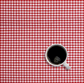 Fresh cup of coffee on a breakfast table - good copy space