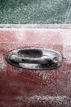 Frozen car after a winter blizzard with copy space for text