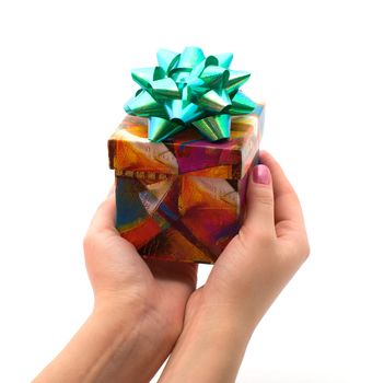 Female hand holding gift box, isolated on a white background.