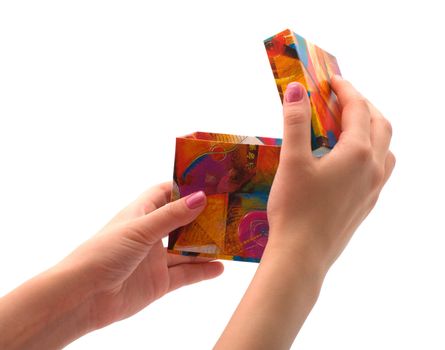 Female hands open a gift box, is isolated on a white background.