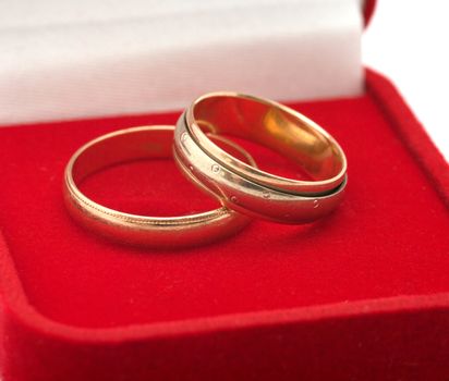 Two gold wedding rings a close up.